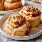Delicious Apple Cheesecake Buns with a Crumble Topping and Sweet Glaze